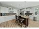 Stylish kitchen with an island, stainless steel appliances, and ample cabinet space at 233 Pointe Park Cir, Holly Springs, NC 27540