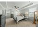 Spacious main bedroom with tray ceiling, fan, and carpet flooring at 233 Pointe Park Cir, Holly Springs, NC 27540