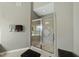 Walk-in shower with decorative tile surround at 233 Pointe Park Cir, Holly Springs, NC 27540