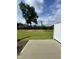 Expansive backyard with a large tree, privacy fence, and concrete patio at 236 Paramount Dr, Smithfield, NC 27577
