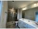Bathroom featuring double sink vanity with a glass enclosed shower and modern fixtures at 236 Paramount Dr, Smithfield, NC 27577