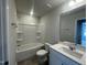 Bright bathroom featuring a shower-tub, single sink vanity, and neutral color scheme at 236 Paramount Dr, Smithfield, NC 27577