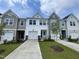 Attractive townhome showcasing a well-manicured lawn and inviting curb appeal in a desirable neighborhood at 236 Paramount Dr, Smithfield, NC 27577