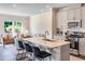 Charming eat-in kitchen featuring stainless appliances, island with counter seating, and hardwood floors at 236 Paramount Dr # 22, Smithfield, NC 27577
