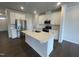 Well-lit kitchen with stainless steel appliances, island with sink, and plenty of white cabinet storage at 236 Paramount Dr, Smithfield, NC 27577