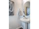 Powder room featuring pedestal sink and modern decor at 236 Paramount Dr # 22, Smithfield, NC 27577