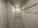 Large walk-in closet with carpet flooring and ample wire shelving for organized storage at 236 Paramount Dr, Smithfield, NC 27577