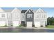 New townhome showcases an attractive exterior with a stone foundation and a single-car garage at 248 Paramount Dr # 25, Smithfield, NC 27577