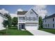 Charming two-story home with a covered porch, and a two-car garage for modern living at 255 Meadowbark Bnd # 31, Garner, NC 27529