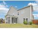 Rear view of the home showcasing the back yard, screened in porch and low-maintenance vinyl siding at 2613 Red Spruce Dr, Raleigh, NC 27616