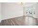Open living area with wood floors, a bay window, and ample natural light at 2613 Red Spruce Dr, Raleigh, NC 27616