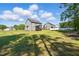 Sprawling backyard featuring a well-maintained lawn and a screened-in porch on the home at 263 Annali Way, Wendell, NC 27591