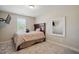 Neutral bedroom with carpet, single bed, window and wall-mounted television at 263 Annali Way, Wendell, NC 27591
