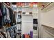 Walk-in closet with custom shelving and rods for optimal storage solutions at 263 Annali Way, Wendell, NC 27591