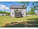 Back exterior view of home featuring a screened in porch and large yard at 263 Annali Way, Wendell, NC 27591