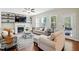 Cozy living room boasts a fireplace, built-in shelving, neutral-toned furniture, and ample natural light at 263 Annali Way, Wendell, NC 27591
