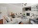 Comfortable living room features a fireplace with a mantle and built-in shelving, neutral furniture, and ceiling fan at 263 Annali Way, Wendell, NC 27591