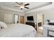 Bright primary bedroom with trey ceilings, carpet floors, and en suite bathroom access for added convenience at 263 Annali Way, Wendell, NC 27591