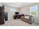 Comfortable office space with a sofa, desk, computer, and a large window at 263 Annali Way, Wendell, NC 27591