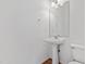 A well-lit bathroom featuring a pedestal sink and classic fixtures at 269 Sweet Bay Pl, Carrboro, NC 27510