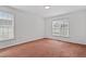 A bright and airy bedroom featuring two windows for natural sunlight at 269 Sweet Bay Pl, Carrboro, NC 27510