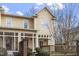 Inviting exterior view of a yellow townhome with a cozy covered porch area at 269 Sweet Bay Pl, Carrboro, NC 27510