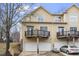 Rear exterior shot showing balcony decks and garages of a multi-unit townhome at 269 Sweet Bay Pl, Carrboro, NC 27510