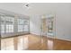 Bright living room with hardwood floors and large windows allowing ample natural light at 269 Sweet Bay Pl, Carrboro, NC 27510