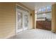 Covered back patio featuring white trim, double doors and serene outdoor views at 269 Sweet Bay Pl, Carrboro, NC 27510