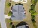 Aerial view of the roof and backyard showcases manicured landscaping, a deck, and a lush green lawn at 316 Hilliard Forest Dr, Cary, NC 27519