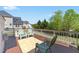 Inviting back deck features outdoor seating with a view of the backyard and surrounding neighborhood at 316 Hilliard Forest Dr, Cary, NC 27519