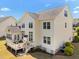 Charming light yellow home boasts a spacious deck, well-manicured lawn, and manicured landscaping at 316 Hilliard Forest Dr, Cary, NC 27519