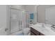 Clean and modern bathroom featuring a glass-enclosed shower, sleek vanity, and updated fixtures at 316 Hilliard Forest Dr, Cary, NC 27519