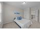 Neutral bedroom with carpet, bed and a blue and white color scheme at 316 Hilliard Forest Dr, Cary, NC 27519