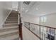 Spacious hallway with a view of the stairway and an overlook down into the living room at 316 Hilliard Forest Dr, Cary, NC 27519