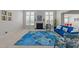 Bright living room with fireplace, large windows, and stylish blue floral furnishings at 316 Hilliard Forest Dr, Cary, NC 27519