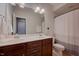 Bathroom features a dual sink vanity, toilet, and shower with gray curtain at 3205 Silver Ore Ct, Wake Forest, NC 27587