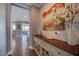 Hallway featuring wood floors, neutral colored walls, and decor at 3205 Silver Ore Ct, Wake Forest, NC 27587