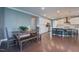 Open floor plan featuring kitchen with breakfast bar, connected to dining area with hardwood floors at 3205 Silver Ore Ct, Wake Forest, NC 27587