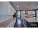 Bright kitchen with granite counters, white cabinets, and stainless steel appliances at 3205 Silver Ore Ct, Wake Forest, NC 27587