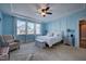 Serene main bedroom with tray ceiling, sitting area, and lots of natural light at 3205 Silver Ore Ct, Wake Forest, NC 27587