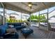 Screened-in porch with stylish furniture, a ceiling fan, and a backyard pool view at 3205 Silver Ore Ct, Wake Forest, NC 27587