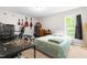 Comfortable bedroom featuring a work space, window, and neutral carpet at 329 Cartwright Cir, Wendell, NC 27591