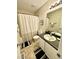 Bright bathroom featuring a shower with white curtain and a vanity with speckled countertop at 334 Cabin Grove Ct, Angier, NC 27501