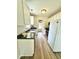 Efficient kitchen featuring white cabinetry, black countertops, and stainless steel appliances at 334 Cabin Grove Ct, Angier, NC 27501
