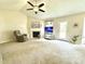 Cozy living room with vaulted ceilings, a fireplace, and comfortable seating area at 334 Cabin Grove Ct, Angier, NC 27501