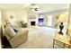 Spacious living room featuring a fireplace, neutral decor, and plenty of natural light at 334 Cabin Grove Ct, Angier, NC 27501