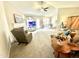 Open-concept living room with a fireplace, view of the adjacent dining area, and comfortable seating at 334 Cabin Grove Ct, Angier, NC 27501