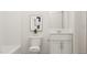 Clean bathroom with a white vanity, toilet, tub and modern finishes at 336 Carolina Springs Blvd, Apex, NC 27539