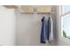 Well-organized closet with hanging rods, shelves, and natural light from a window at 336 Carolina Springs Blvd, Apex, NC 27539